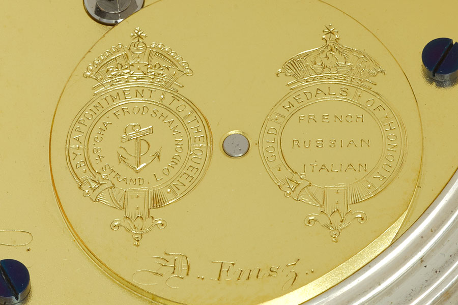 Two cyphers on the raised barrel of a Charles Frodsham pocket watch, indicating that watches were supplied to the Admiralty, and were awarded multiple prises for timekeeping (Photo (C) Charles Frodsham & Co Ltd 2018)